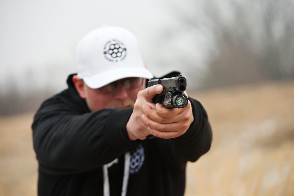 Zach Anderson, Owner at River Valley Arms & Ammo (RVAA), demonstrates firearm safety rules.