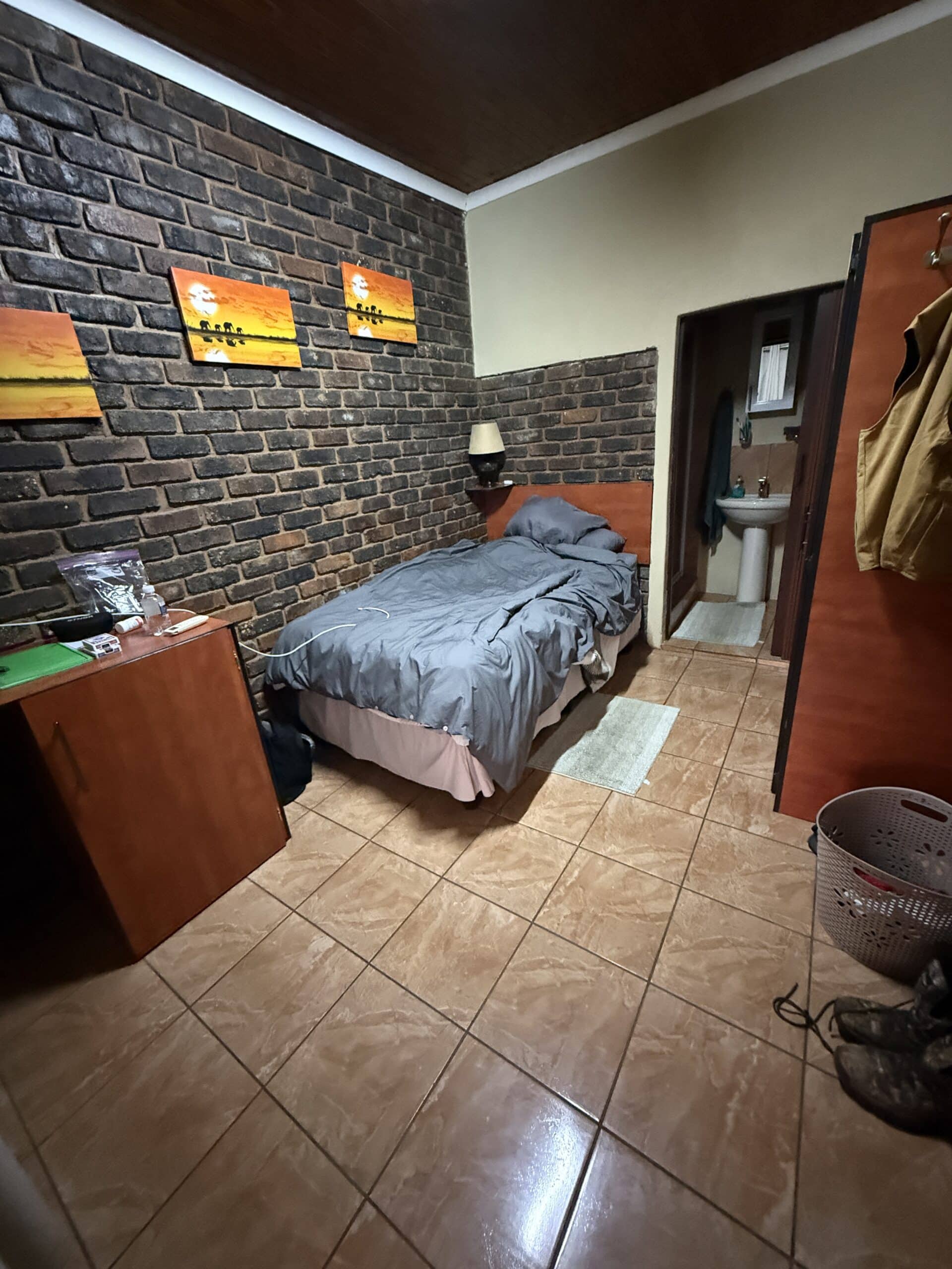 Single room included a twin bed and an en suite bathroom with a shower.