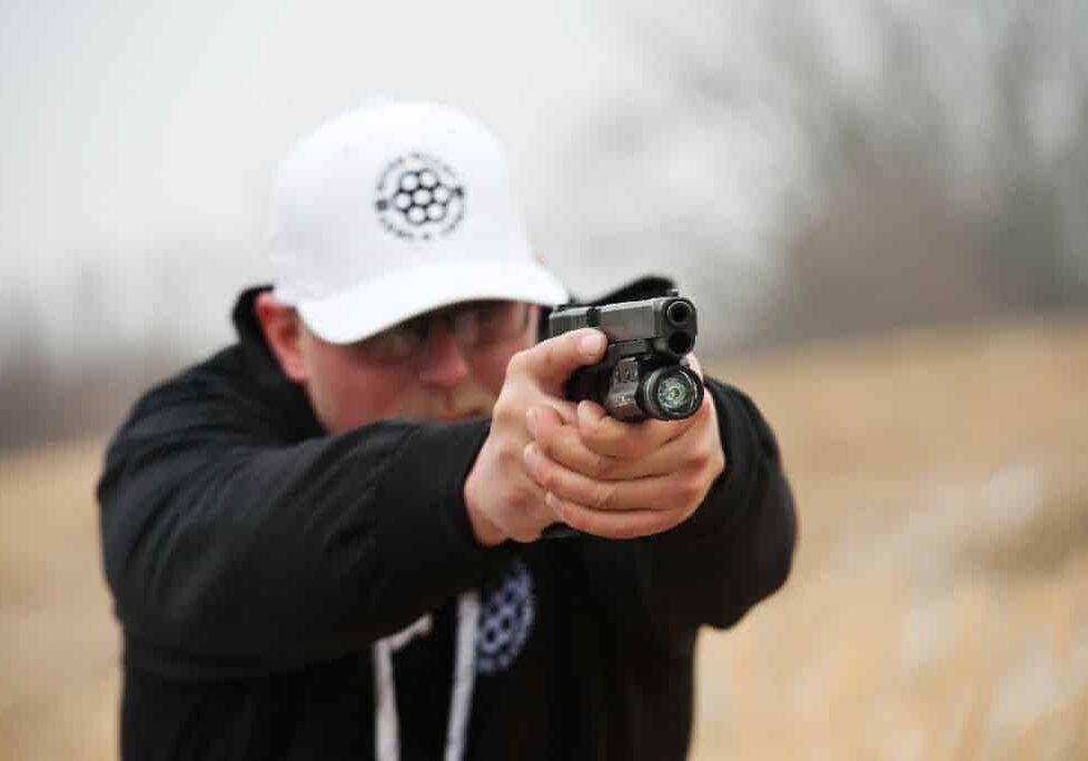 zach anderson, owner at river valley arms & ammo (rvaa), demonstrates firearm safety rules.